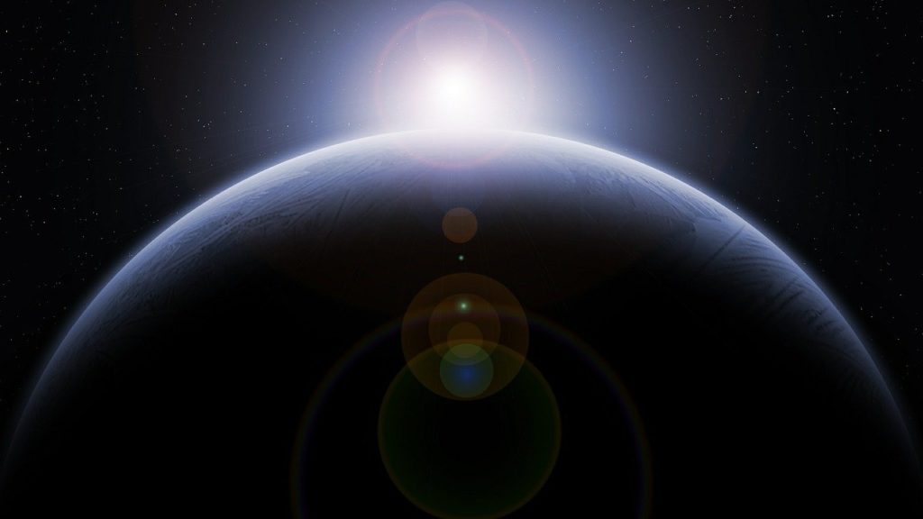 the earth lit by the sun and cast in shadow